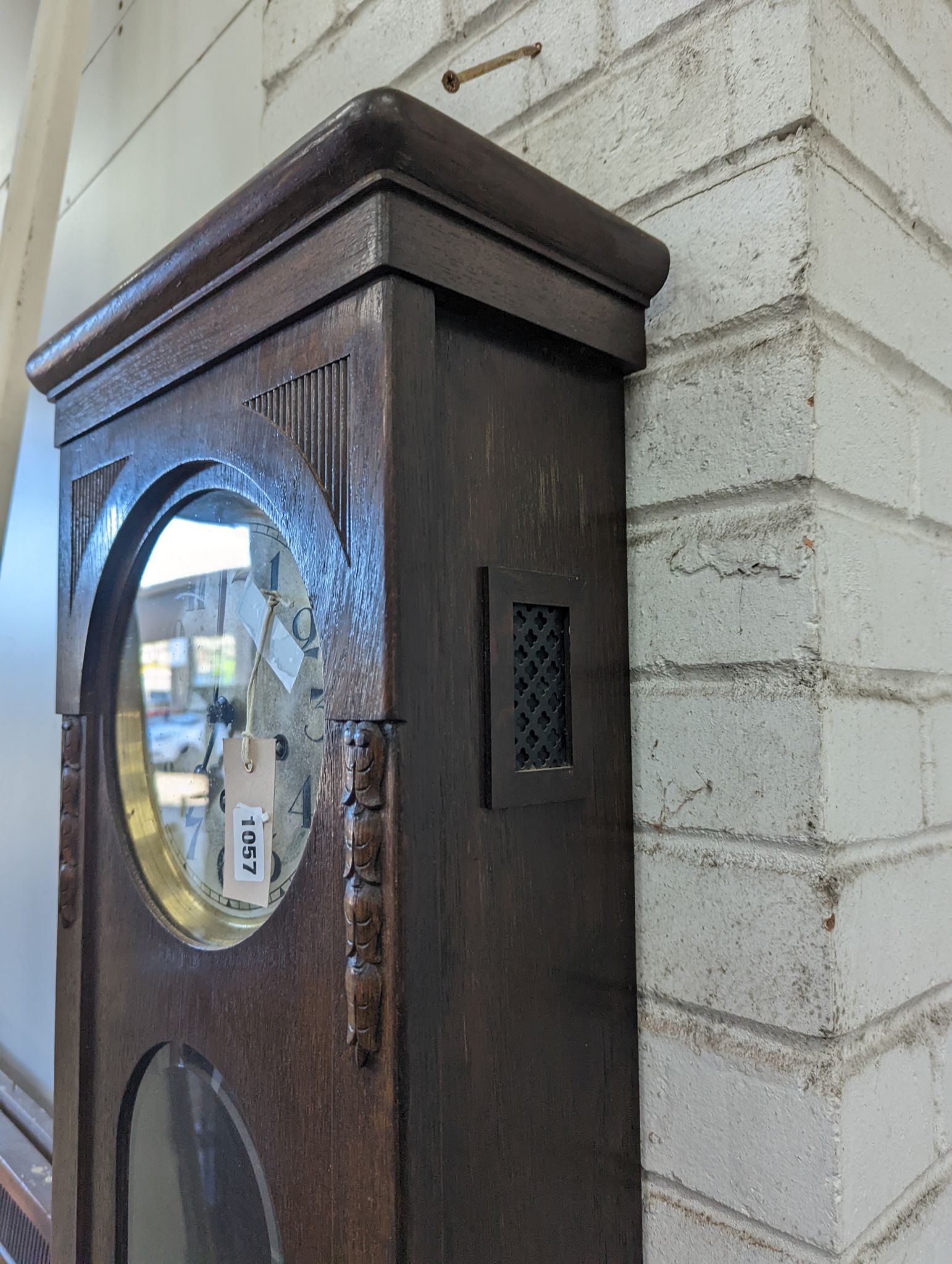 A 1920's oak cased wall clock, height 80cm